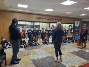 Mrs Gillon speaking with 3rd graders