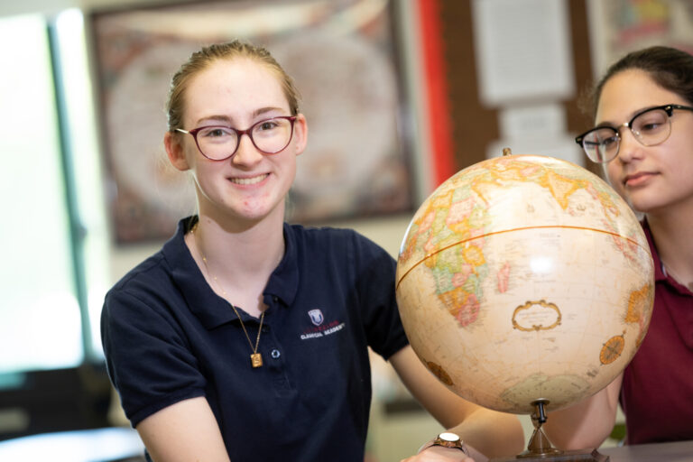 Student Smiling Classroom Globe