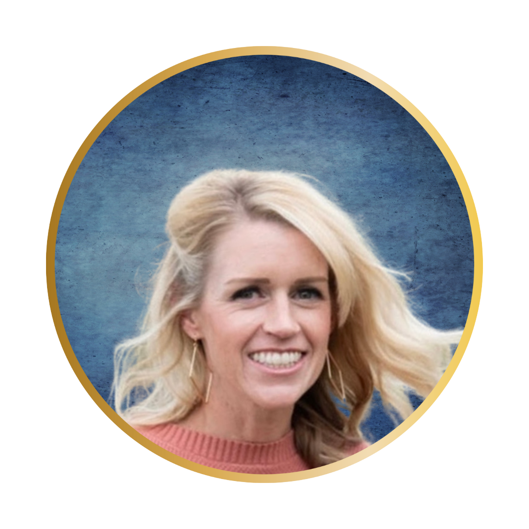 Portrait of a smiling woman with blonde hair in a cozy sweater against a blue background.