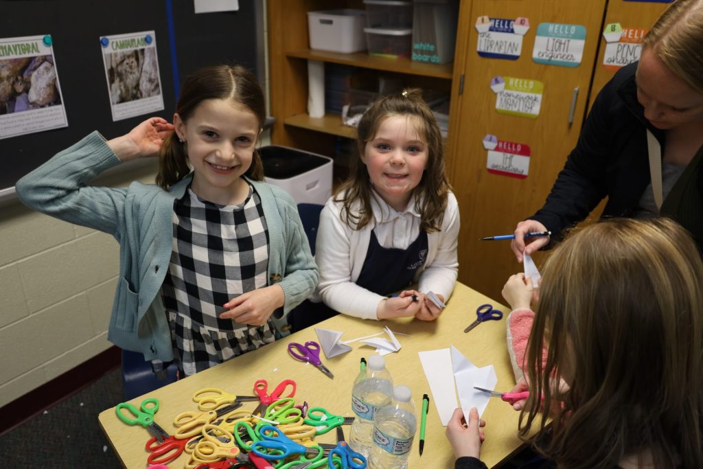 Creative classroom scene with students crafting, vibrant colors, and engaged learning atmosphere.